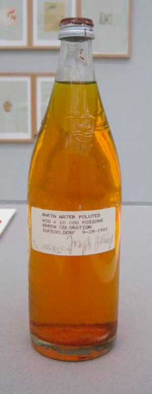Joseph Beuys - Rhine Water Polluted, 1981, bottle containing green-dyed Rhine water, label, screw-cap with oil paint (Browncross)