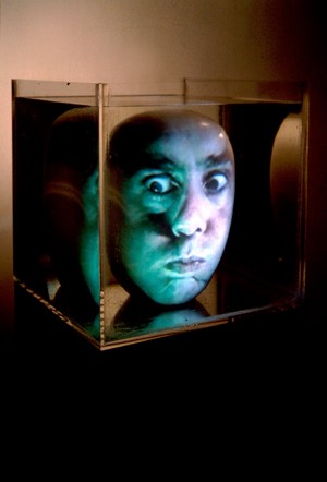 Tony Oursler - Underwater (Blue/Green), 1996, Citizen CPJ100 projector, Samsung VCR, videotape, tripod, acrylic on fiberglass sphere, performance by: Tony Oursler
