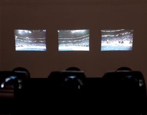 Paul Pfeiffer - Three Studies for Figures at the Base of a Crucifixion, 2001, metal armatures, miniature video projectors, 3 DVDs with continuous digital video loops, DVD players