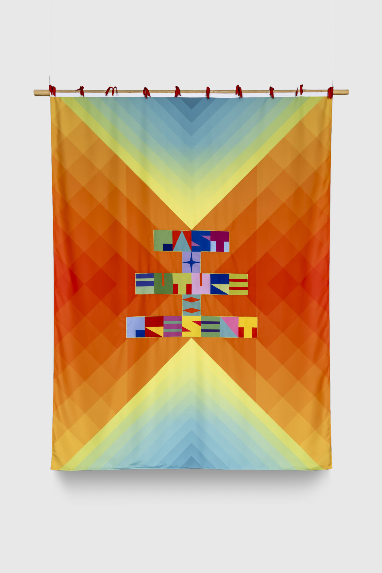 Jeffrey Gibson's "Past + Future = Present" Artwork featuring multi-colored geometric shapes and a designed alphabet spelling out the title of the work.