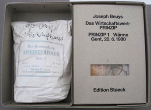 Joseph Beuys - Das Wirtschaftswert-PRINZIP, 1981, three boxes with picture postcards, a bag of dried peas with handwritten addition; in cardboard box