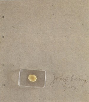Joseph Beuys - Fingernagelabdruck aus gehärteter Butter, 1971, butter/wax in plastic box on gray cardboard