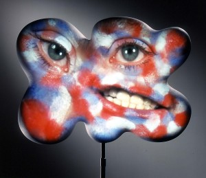 Tony Oursler - Flag, 2004, fiberglass sculpture, Sony VPL CS5 projector, DVD, DVD player