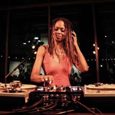DJ Francesca Harding at turntables during a live performance