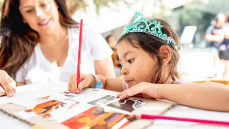 Photo of child and woman at Family Weekend Workshops.