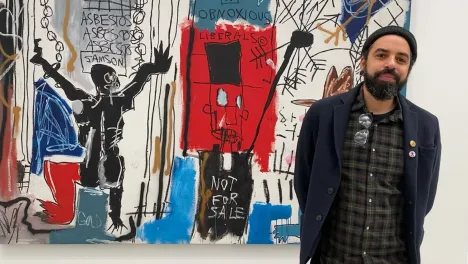 James Spooner in front of Jean-Michel Basquiat's Obnoxious Liberals
