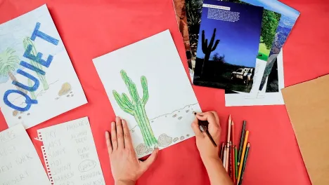 still of woman's hands drawing from the Ed Ruscha-inspired family art workshop