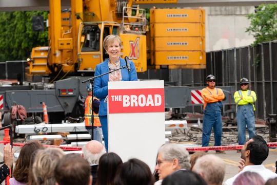 Joanne Heyley speaking at a podium during The Broad's topping out ceremony