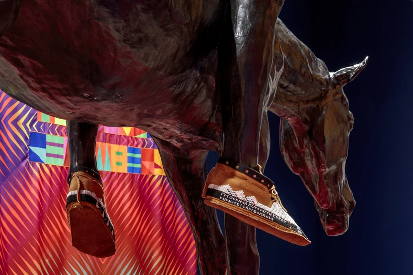 Close up of moccasins on bronzed sculpture in flag gallery