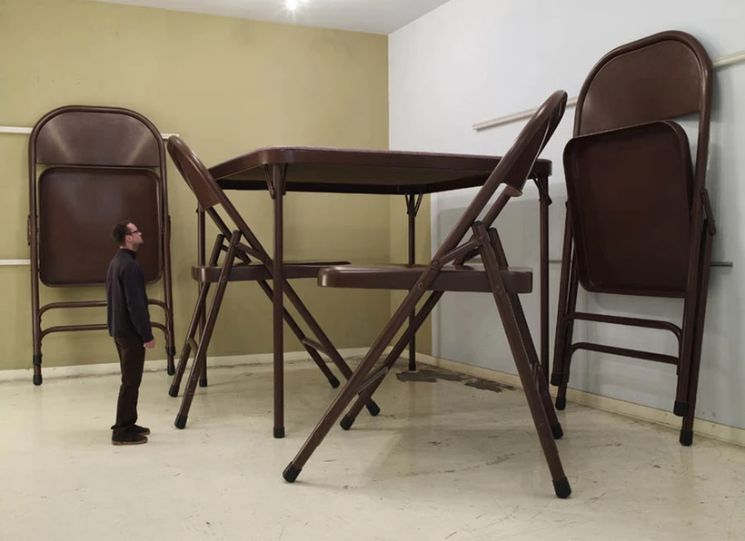 oversized brown folding table with a person next to it for size