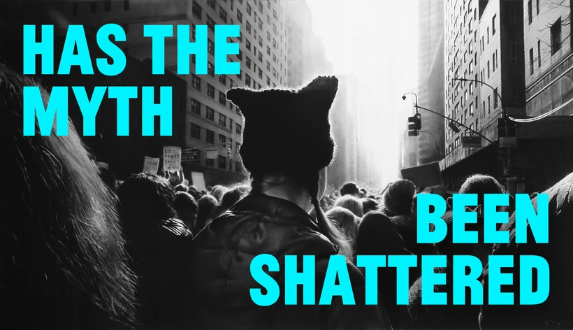 Turquoise text reading “Has the myth been shattered” overlays Robert Longo’s artwork Untitled (Black Pussy Hat in Women's March), depicting a crowd on a city street with a person wearing a black cat-eared hat in the foreground.