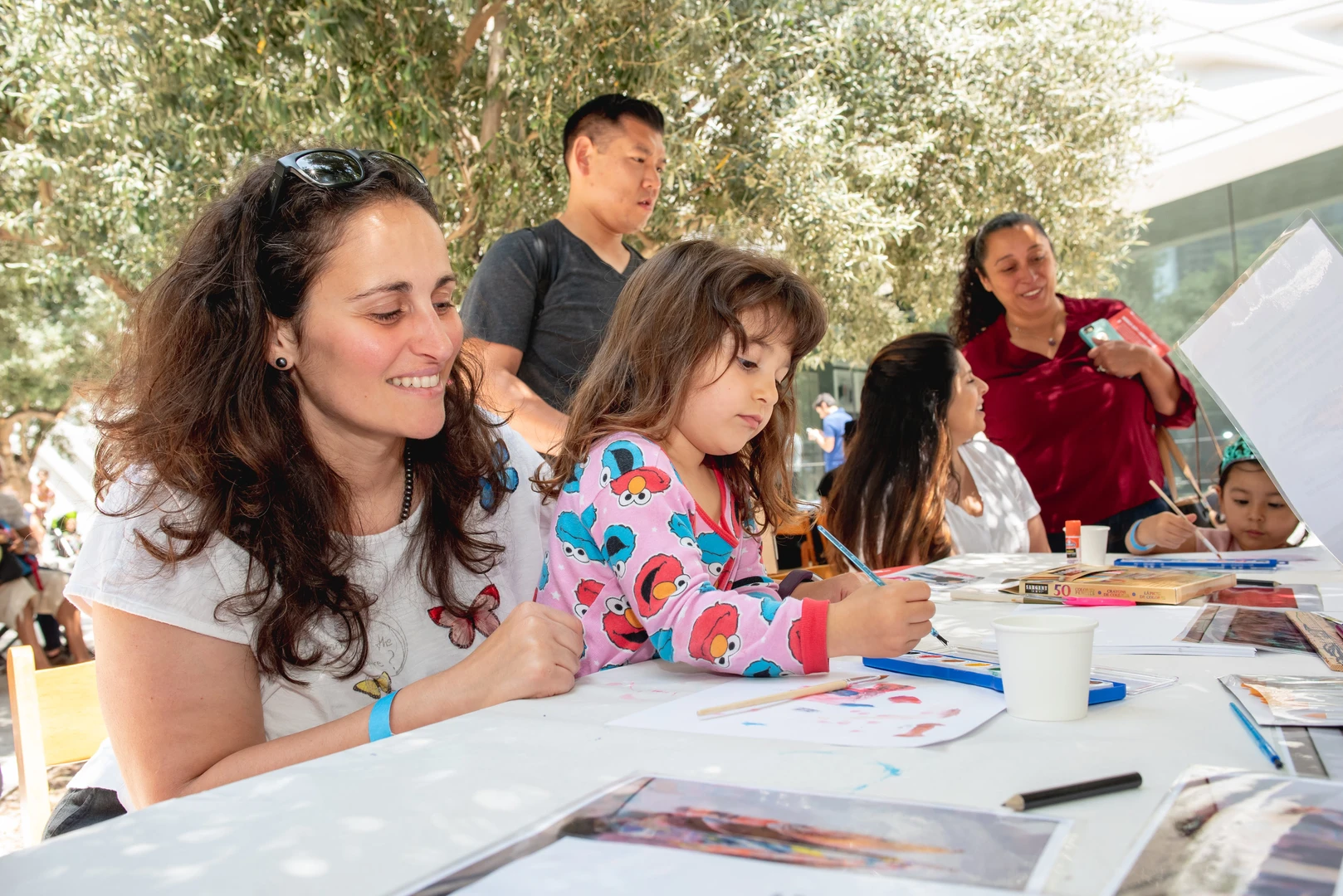 family making art at a table