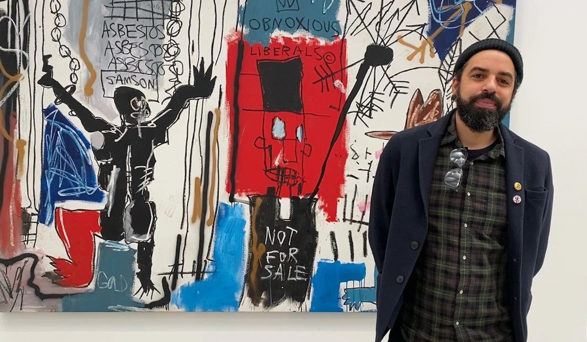 James Spooner in front of Jean-Michel Basquiat's Obnoxious Liberals