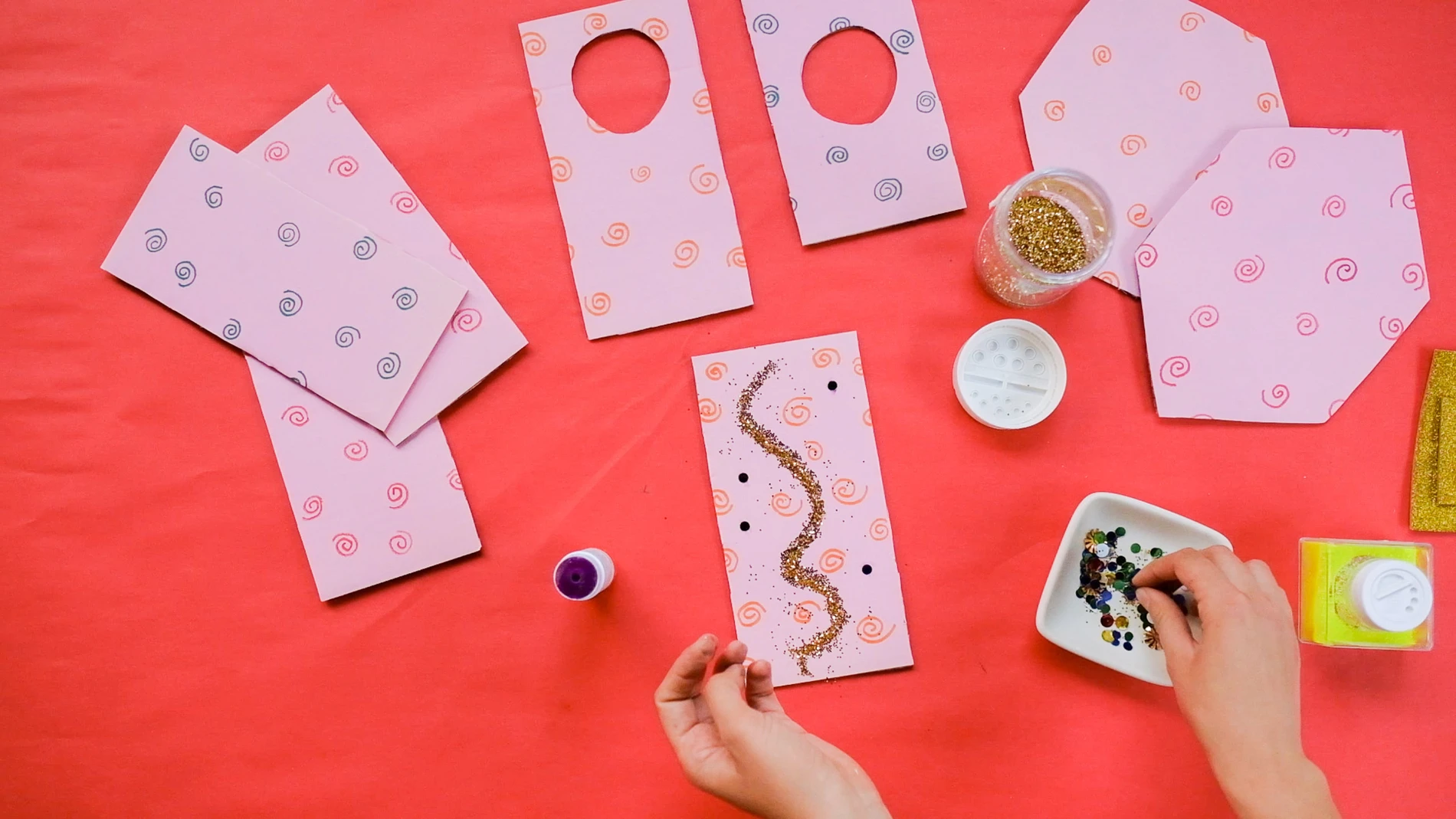 still of woman's hands making art from the Yayoi Kusama-inspired family art workshop