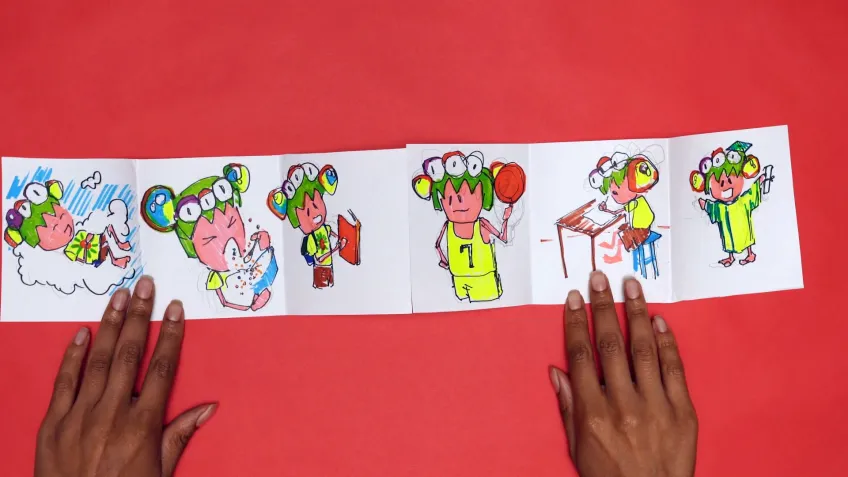 still of woman's hands showing her art activity from the Takashi Murakami-inspired family art workshop