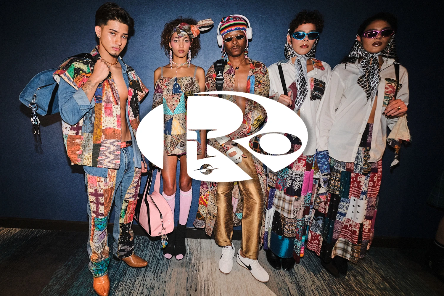 A group of five models modeling Rio World clothing behind a Rio white logo
