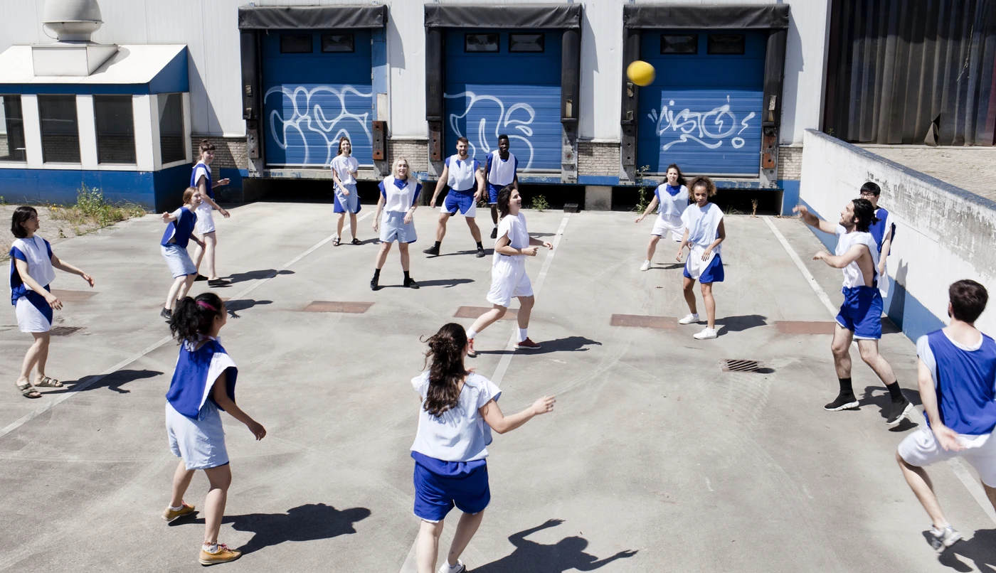 Kids playing Multiform on a cement playing field