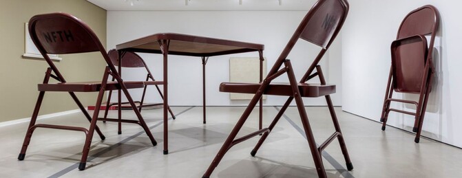 Robert Therrien sculpture of a large oversized brown folding table and chairs