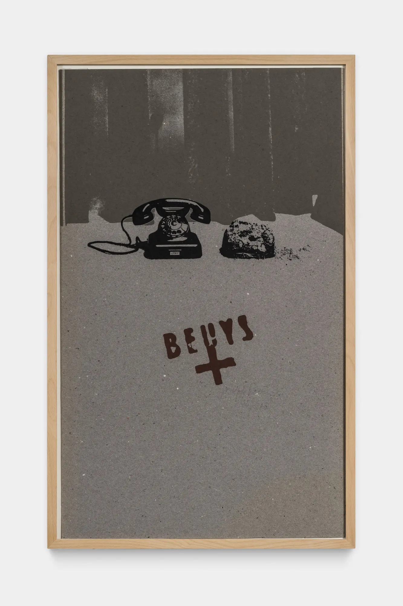 Black and white photo of a telephone and red font that says Beuys